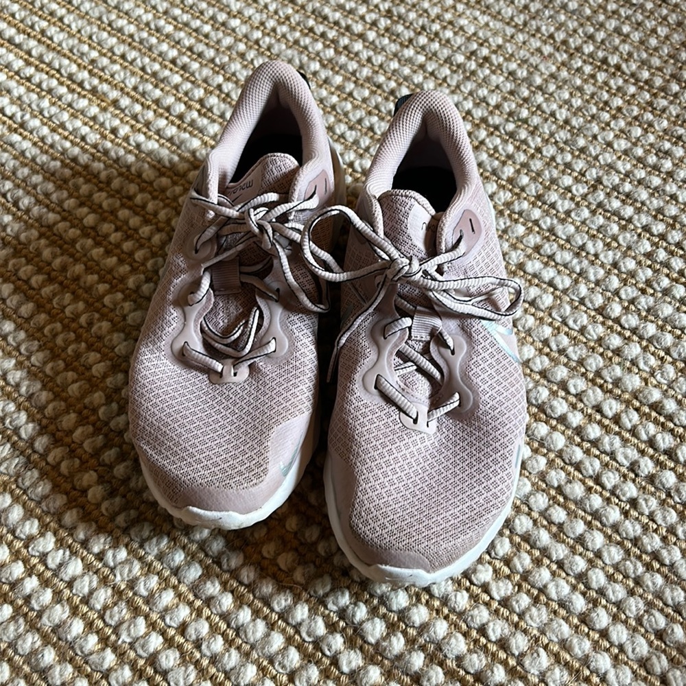 Pink Nike running shoes